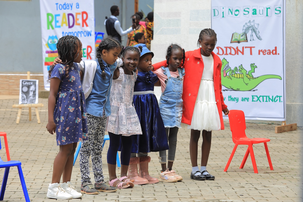 Students reading and learning at Merryland International School Uganda