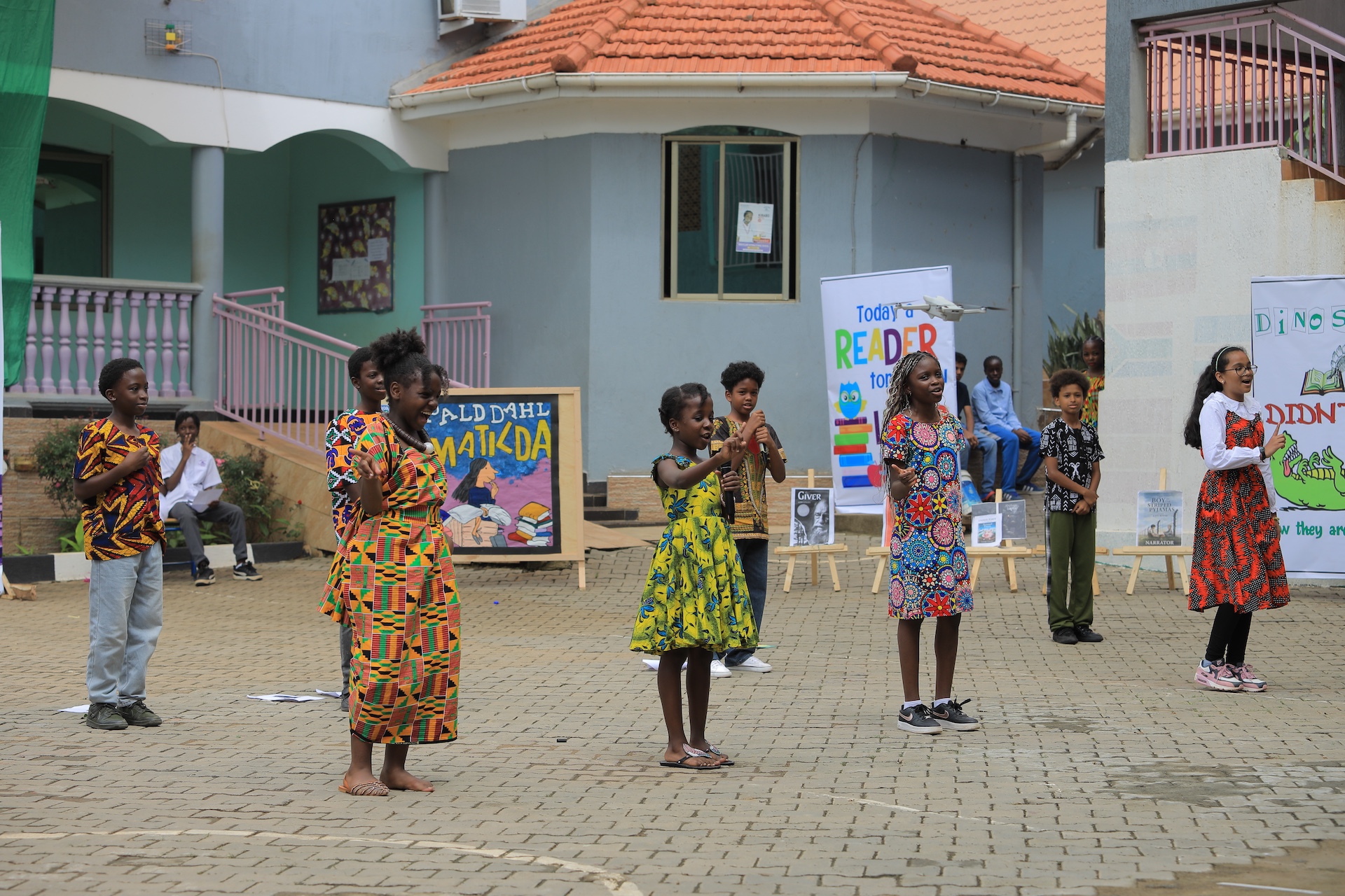 Students reading and learning at Merryland International School Uganda